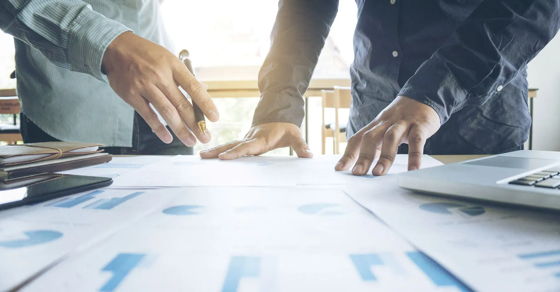 Two business owners working through figures together at a desk